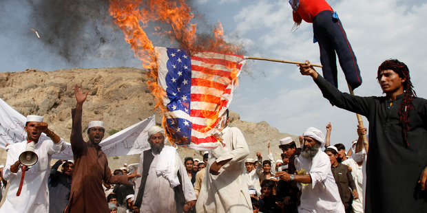 Afghans burn the US flag in Ghanikhel district of Nangarhar province, east of Kabul. Photo / AP