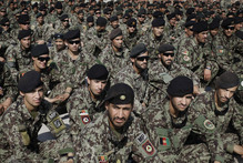 Afghan soldiers attend the ceremony for the handover of the US-run prison at Bagram to the Kabul Government. The West's future role in the country is less than certain.  Photo / AP 