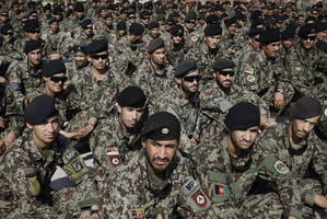 Afghan soldiers attend the ceremony for the handover of the US-run prison at Bagram to the Kabul Government. The West's future role in the country is less than certain. Photo / AP