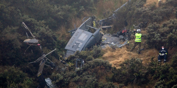 The Iroquois helicopter crashed into a steep hillside near Wellington killing three men. Photo / Mark Mitchell