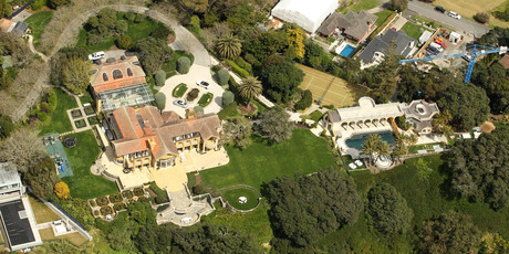 The clifftop mansion and grounds of New Zealand's richest man in Glendowie (left) and the cheapest house on Whanganui River Rd. Photos / Janna Dixon, APN