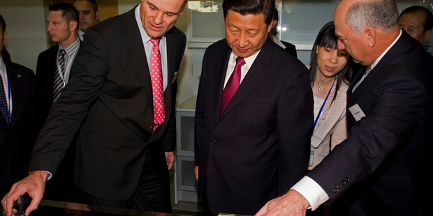 Fisher and Paykel CEO Stuart Broadhurst, left, shows the company's wares to China vice president Xi Jinping during a visit last year. Photo / NZ Herald