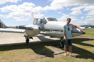Sam Godfrey, 15, with his favourite plane a Piper PA23 Aztec. Photo / Betty Jeeves