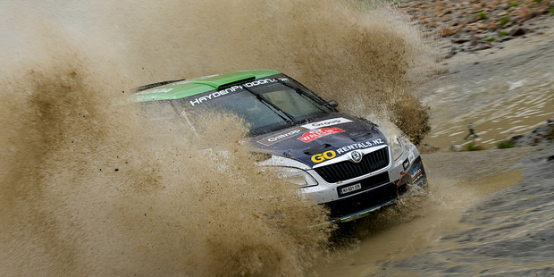 Hayden Paddon and John Kennard tackle a water splash on day one of Wales Rally GB. Photo / Honza Fronek