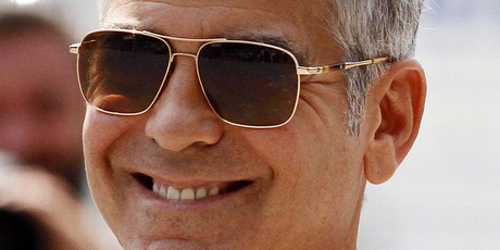George Clooney is still dating Stacy Keibler, despite reports to the contrary. Photo / AP
