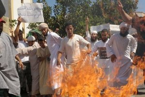Moroccan protesters burn a US flag in Sale. Photo / AFP