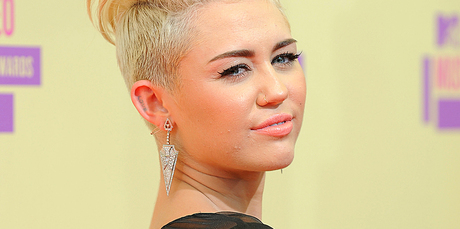 A man arrested outside Miley Cyrus' LA home reportedly claimed to be married to the star. Photo / AP