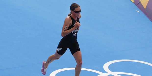 Nicky Samuels runs across the Olympic Rings during the run stage in the women's triathlon at Hyde Park. Photo / Mark Mitchell