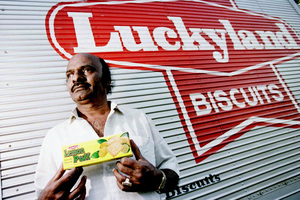 Factory owner SinNasamy Muthiah is as proud of his biscuits as he is his son, spin bowling legend Muttiah Muralitharan. Photo / Getty Images