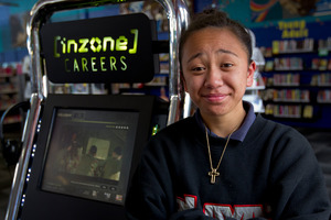 Paris Walker, 13, watched a clip from the NZ Army at a kiosk installed at the Otara Library. Photo / Sarah Ivey