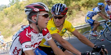 Lance Armstrong (in yellow) and compatriot Tyler Hamilton, who helped author Daniel Coyle lift the lid on doping in cycling. Photo / AFP