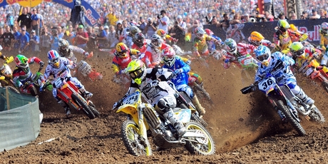 Queenstown's Sctty Columb (bike No. 24) snatches the lead for Team New Zealand during the Motocross of Nations in Italy in 2009. Photo / BikesportNZ.com