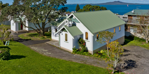 The Castor Bay church is thought to be more than 100 years old. It and the church hall, built in 1933, sit on a 1133sq m block of prime real estate. Photo / Supplied