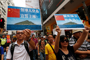 Anti-Japan protesters hold picture of the dipusted island, known as Senkaku in Japanese and Diaoyu in Chinese. Photo / AP