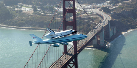 Space shuttle Endeavour and its 747 carrier aircraft soar over the Golden Gate Bridge in San Francisco. Photo / AP