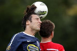 Ivan Vicelich (left) of Auckland City heads the ball as he jumps with Allan Pearce of Waitakere United (right). Photo / Sarah Ivey