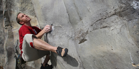 Rock climber Zane Bray trains at the rock wall at Auckland Grammar School. Photo / The Aucklander