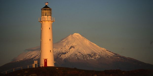 Cape Egmont lighthouse is closely linked to its namesake mountain. Photo / Steve Sole