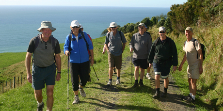 Trampers enjoy the scenery on the walk to Homunga Bay. Photo / Waihi Leader