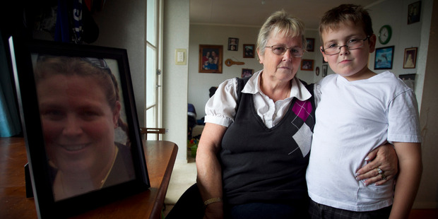 Iris Rae and her grandson Braden Rae with a photo of Natalie. Photo / Natalie Slade