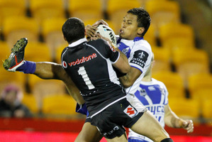 Warrior's Kevin Locke competes for the ball against Bulldogs Ben Barba in an NRL rugby league match. Photo / Wayne Drought