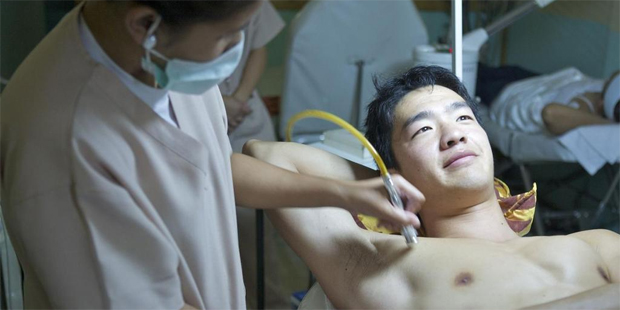 Derek Cheng gets the Diamond Peel treatment. Photo / Hanna Marton/Getty