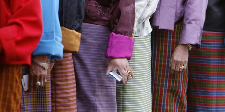 Voters in Bhutan wait to cast their votes. Local politicians had details of their private lives splashed across the media after journalists asked the men's wives to dish the dirt on their husbands. Photo / Reuters