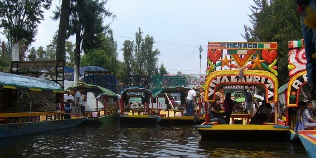 The canals at Xochimilco in Mexico City are filled with colourful gondolas carrying picnicking groups and mariachi bands. Photo / Amy Rosenfeld