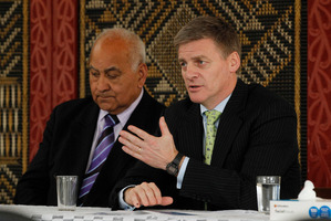 Bill English (right, with kaumatua Hemana Eruera) says asset sales would lessen state borrowing. Picture / Christine Cornege