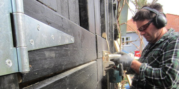 Justin Newcombe constructing the stable door. Photo / Supplied
