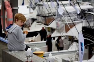 Dillon Mulgrew is wary of the seagulls looking for food as he eats his lunch at the boat show yesterday. Photo / Sarah Ivey