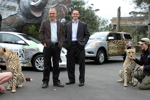 Zoo keeper Anneke Haworth with Anubis, Auckland Zoo director Jonathan Wilcken and Glenn Harris of Mazda.