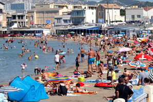 People bathe at Pointe Rouge in Marseille, a world away from the voilent northern suburbs. Photo / AP