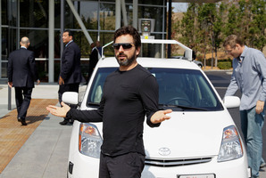 Google co-founder Sergey Brin with a self-driving Prius (and right) on the day California law was changed to allow 'autonomous vehicles'.
Photo / Eric Risberg