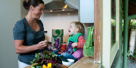 Charlotte Rebbeck, managing director of Green Monkey, organic baby food producer, with daughter Eve. File photo / Simon Baker