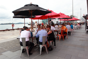 People enjoy the ease of access and cafe lifestyle of Wynyard Quarter. Photo / APN