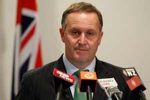 John Key clearly feels uncomfortable about the week's events, which top the scandal where an SIS briefcase containing a Penthouse and some pies was found in the street. Photo / Mark Mitchell
