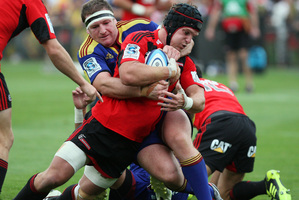 Matt Todd in the tackle of Highlander's Chris King. Photo / NZPA
