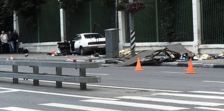 Victims of a road incident lie under emergency blankets on a street in a sparsely populated part of western Moscow. Photo / AFP
