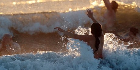 Nudists take part in the North East Skinny Dip at Druridge Bay in Northumberland.
Photo / AFP