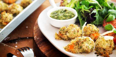Crumbed scallops with grilled tomatoes and salsa verde. Photo / Babiche Martens