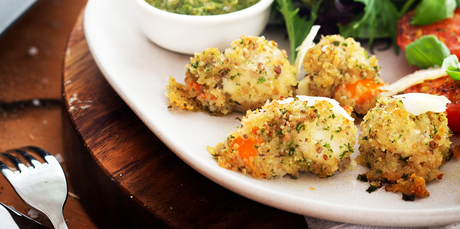 Crumbed scallops with grilled tomatoes and salsa verde. Photo / Babiche Martens