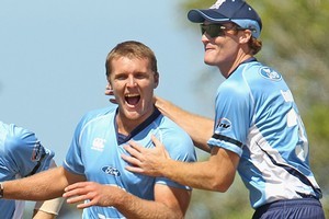 Michael Bates (L) joins Auckland teammate Martin Guptill (R) in the one-day and Twenty20 squads. Photo / Getty Images
