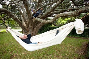 Justin Newcombe takes time to reflect in his self-named slacker hammock. Photo / Dean Purcell