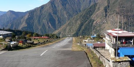 Landing or taking off from Lukla Airport in Nepal is a nail-biting experience, with a cliff at the end of the runway. Photo / Jim Eagles