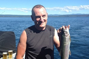 Trevor Mallard shows off his catch while out with other caucus members on Lake Taupo yesterday. Photo / Claire Trevett