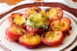 Honey-grilled plums with basil sorbet. Photo / Babiche Martens