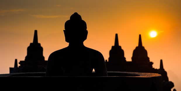 The silhouette of a Borobudur temple Buddha at sunrise. Photo / Thinkstock