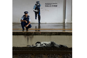 Constable Aji Basra assisted this intoxicated man off the tracks at a rail underpass in Auckland in 2007. Photo / NZ Police