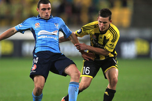 Mitchell Mallia of Sydney FC (L) and Louis Fenton of the Phoenix (R) tackle for the ball during the round one A-League match between the Wellington Phoenix and Sydney FC. Photo / Phil Walter
